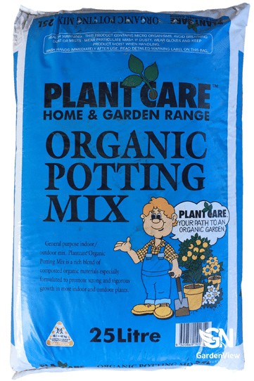 A 25-litre bag of premium potting mix with rich, dark soil visible, positioned in a garden setting